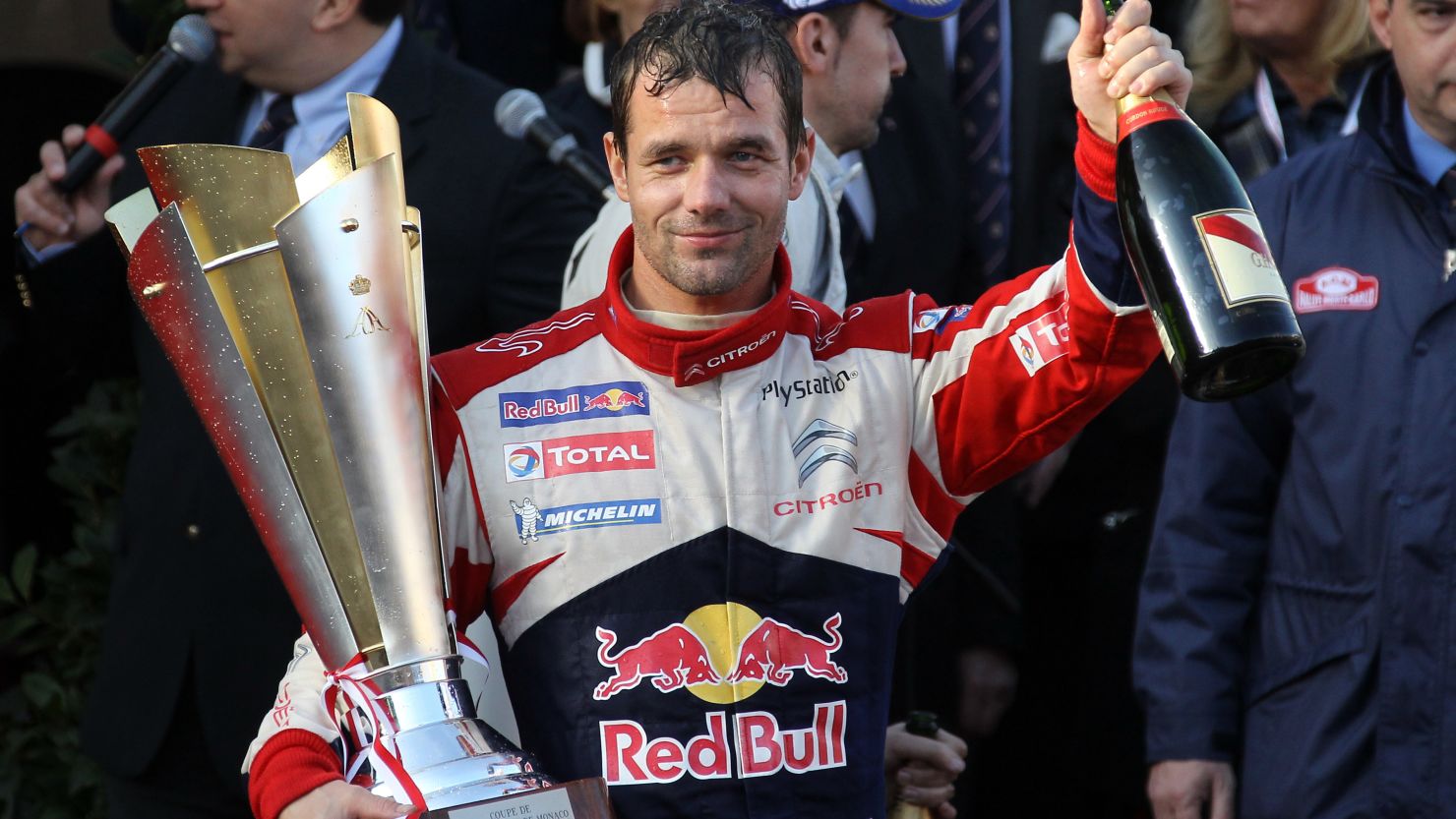 Frenchman Sebastien Loeb celebrates after winning his sixth Monte Carlo Rally title.