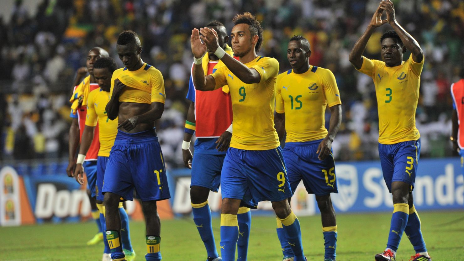 Gabon players, led by opening scorer Pierre-Emerick Aubameyang (No.9), celebrate their 2-0 victory over Niger.