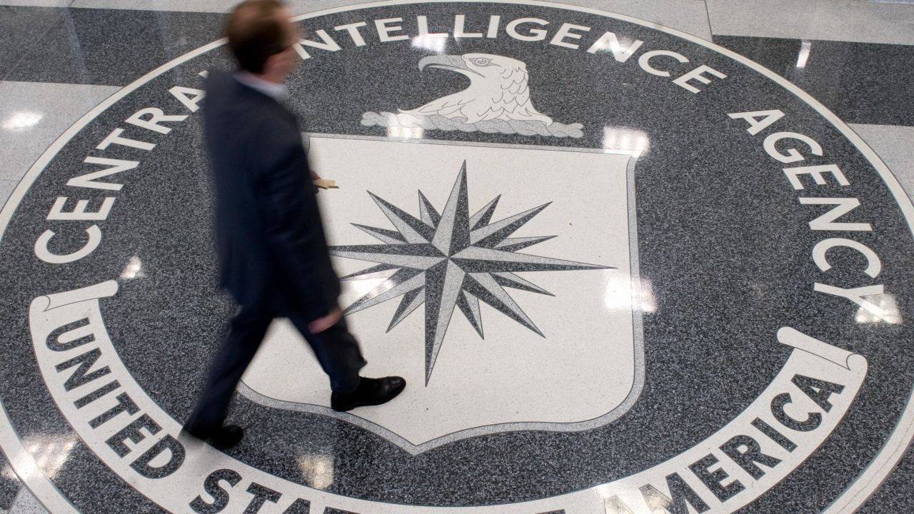	A man crosses the Central Intelligence Agency (CIA) logo in the lobby of CIA Headquarters in Langley, Virginia, on August 14, 2008. 