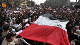 Protestors carry a large Egyptian flag through Tahrir Square on January 31, 2011 in Cairo, Egypt. 