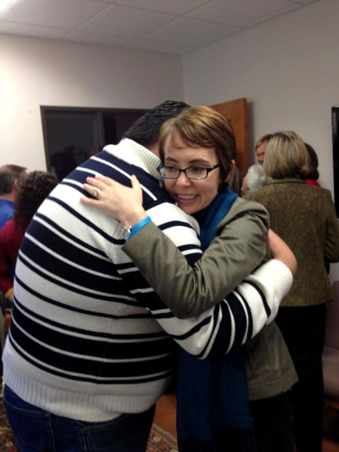 On her last day in office, Rep. Gabrielle Giffords hugs Daniel Hernandez, the former intern who saved her life.
