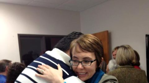 On her last day in office, Rep. Gabrielle Giffords hugs Daniel Hernandez, the former intern who saved her life.