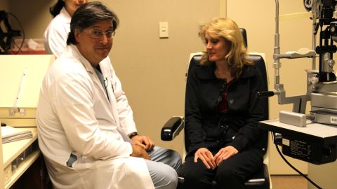 Dr. Steven Schwartz and a 51-year-old patient who says her vision has improved after stem cell treatment.
