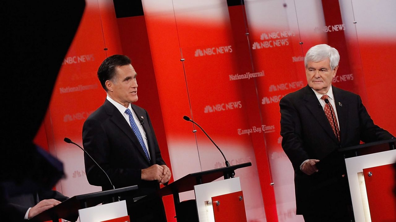 Mitt Romney and Newt Gingrich debate in Tampa, Florida, on Monday night.