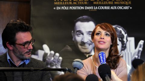 Michel Hazanavicius, director of "The Artist," and his wife, actress Berenice Bejo, hold a news conference in Paris on Tuesday.