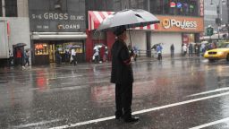 A doorman tries to hail a cab in the rain on September 6, 2011 in New York City.