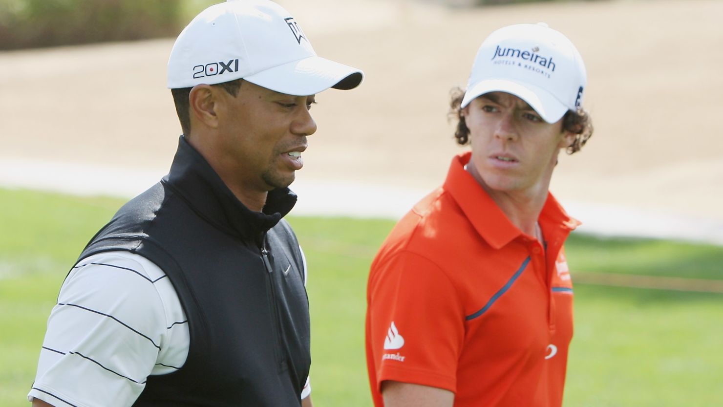 Rory McIlroy (right) will play with Tiger Woods in the opening two rounds of the Abu Dhabi Golf Championship.