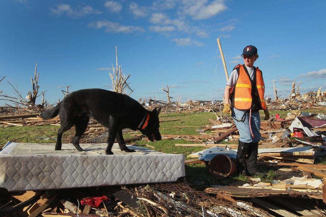 A search team looks for possible victims from the tornado that hit Joplin, Missouri, in May 2011.