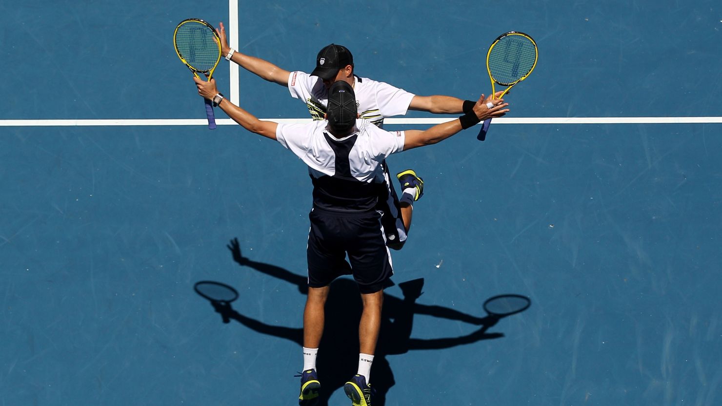 Bob and Mike Bryan perform their customary chest bump after their semifinal win on Thursday.