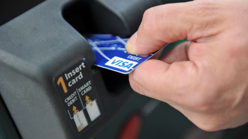 A credit card is swiped at a parking meter on August 20, 2010 in Washington. New rules issued by the US Federal Reserve Board regarding late payment fees on credit cards take effect on August 22. EDS NOTE: The card number has been intentionally blurred.       AFP PHOTO/TIM SLOAN (Photo credit should read TIM SLOAN/AFP/Getty Images)