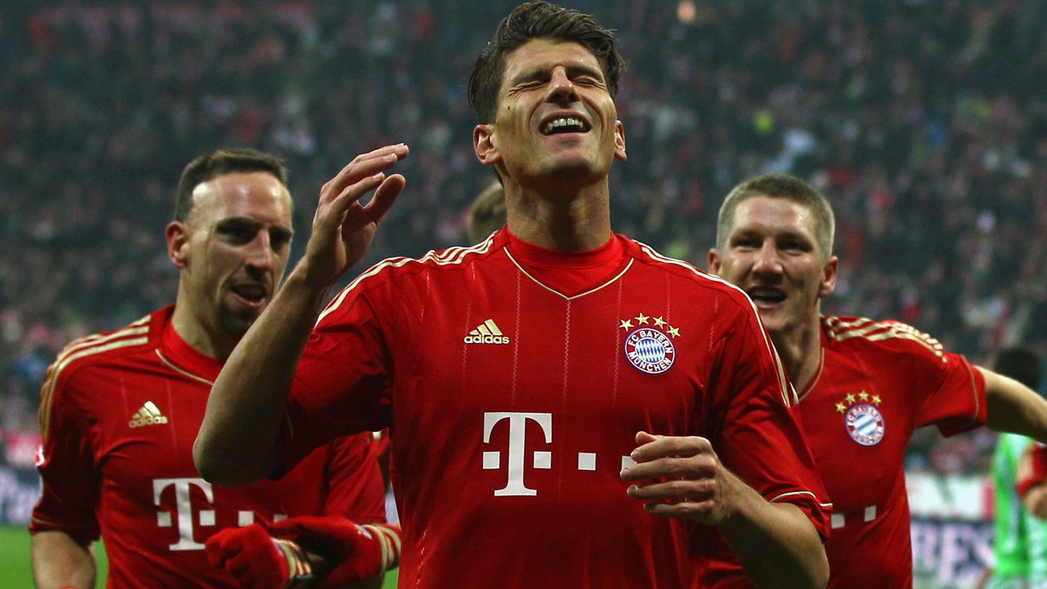 Mario Gomez celebrates scoring the opening goal for Bayern Munich in a 2-0 win against Wolfsburg