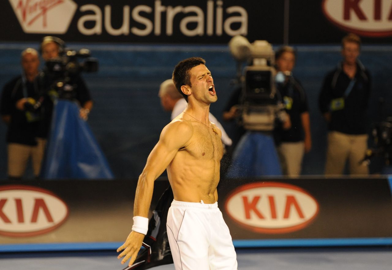 Djokovic bares his chest after completing his epic six-hour, five-set victory over Rafael Nadal to win the 2012 Australian Open title.