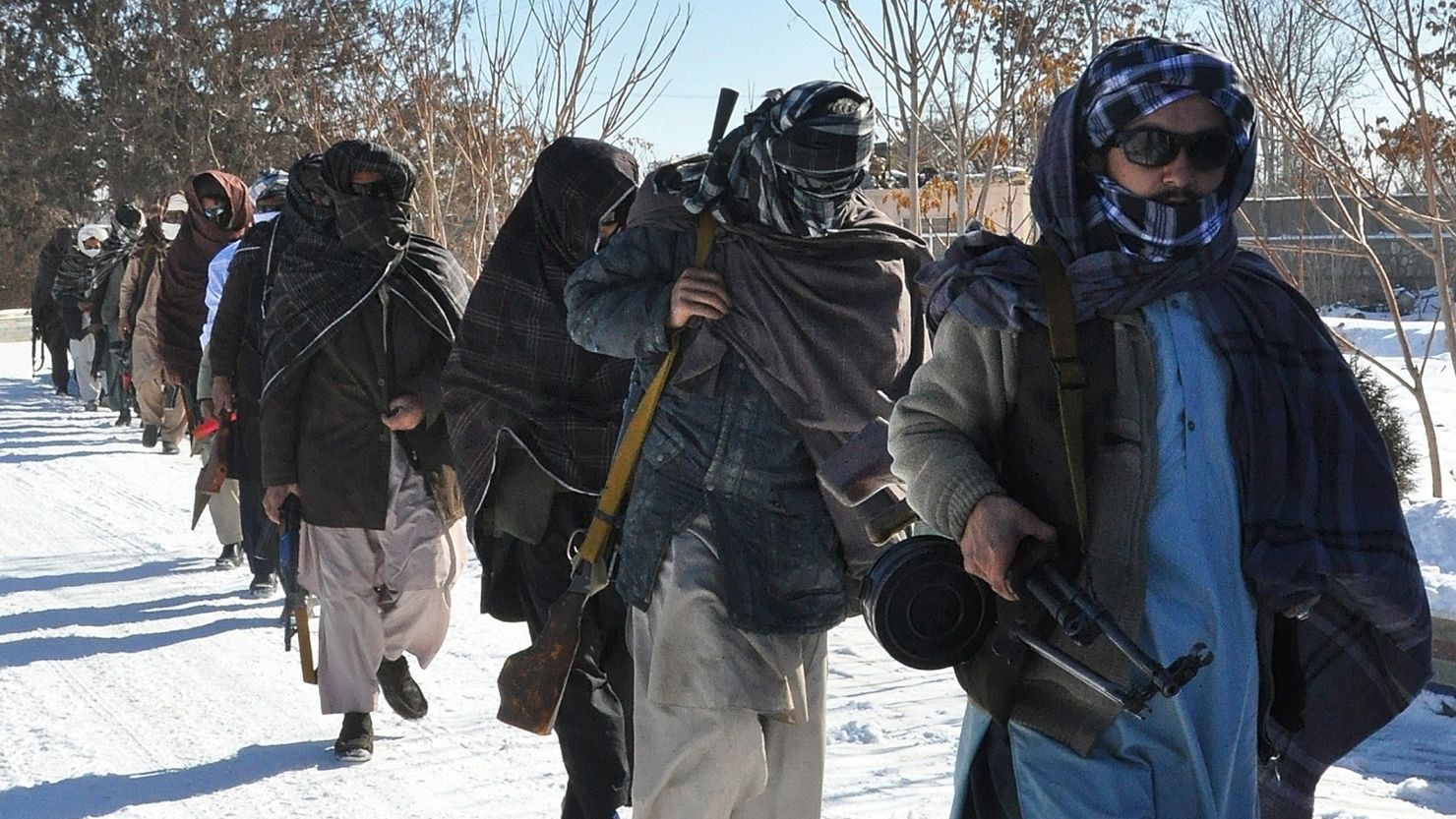 Taliban fighters pictured after joining Afghan government forces for a ceremony in Ghazni province on January 16.