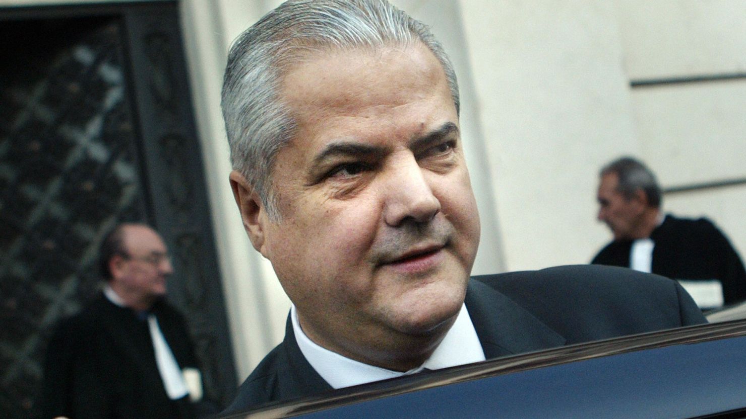 Former Romanian Prime Minister Adrian Nastase leaves the High Court of Justice during his trial.
