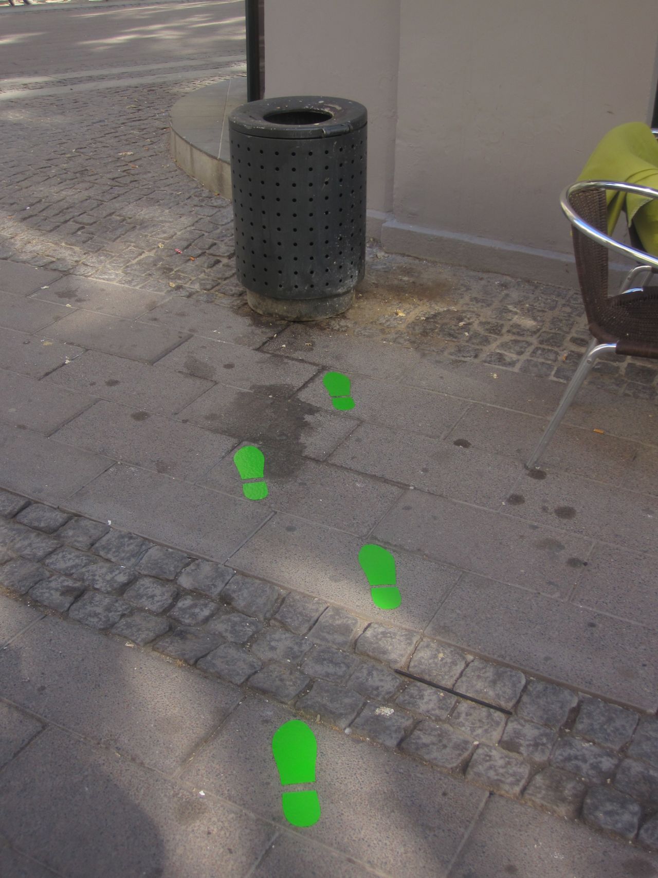 Green footsteps lead passersby to a dustbin on the streets of Copenhagen. Researchers found that this decreased the instances of littering by 46%.