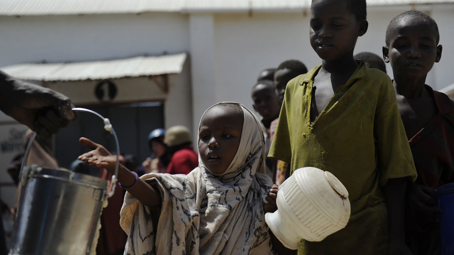Displaced Somali children queue as they wait for food-aid rations in the capital, Mogadishu, on January 19, 2012.