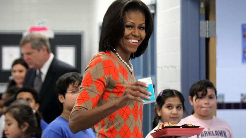 U.S. first lady Michelle Obama joins students at the food line to pick up lunch items at the cafeteria of Parklawn Elementary School January 25, 2012 in Alexandria, Virginia.