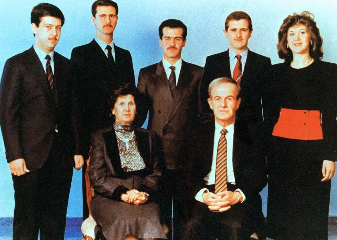 An undated picture shows Syrian President Hafez al-Assad and his wife Anisseh posing for a family picture with his children Maher, Bashar, Basil, who died in a car accident in 1994, Majd and Bushra.