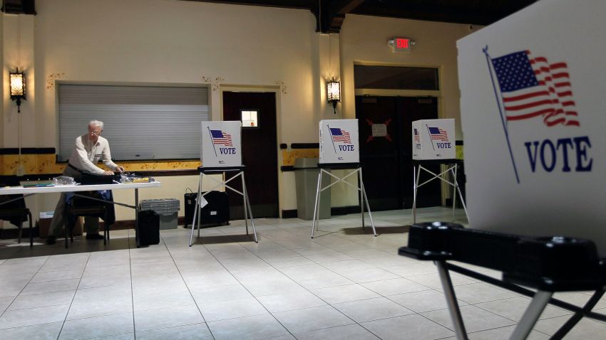 TAMPA, FL - JANUARY 31: Ray Roy sets up a polling station as they prepare for voters on primary day on January 31, 2012 in Tampa, Florida. Republican voters head to the polls as their party continues the process of deciding who will be their general election candidate against President Barack Obama. (Photo by Joe Raedle/Getty Images)