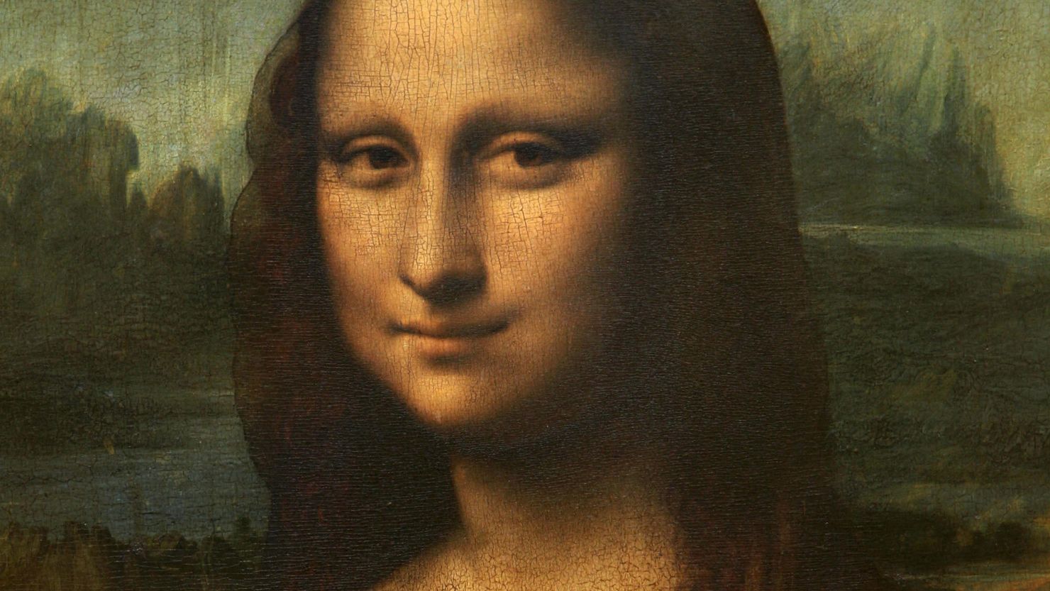 Leonardo da Vinci's "Mona Lisa" portrait hangs in the Louvre museum in Paris, France.
