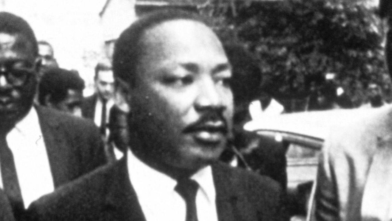 Don Cornelius, seen to the right of Martin Luther King Jr., didn't preach protest on Soul Train. But the show's impact was political, some say.
