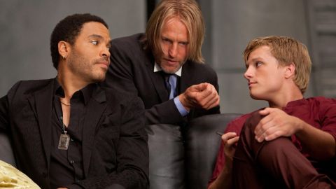 Lenny Kravitz, left, stars in "The Hunger Games" as Cinna, with Woody Harrelson as Haymitch and Josh Hutcherson as Peeta.