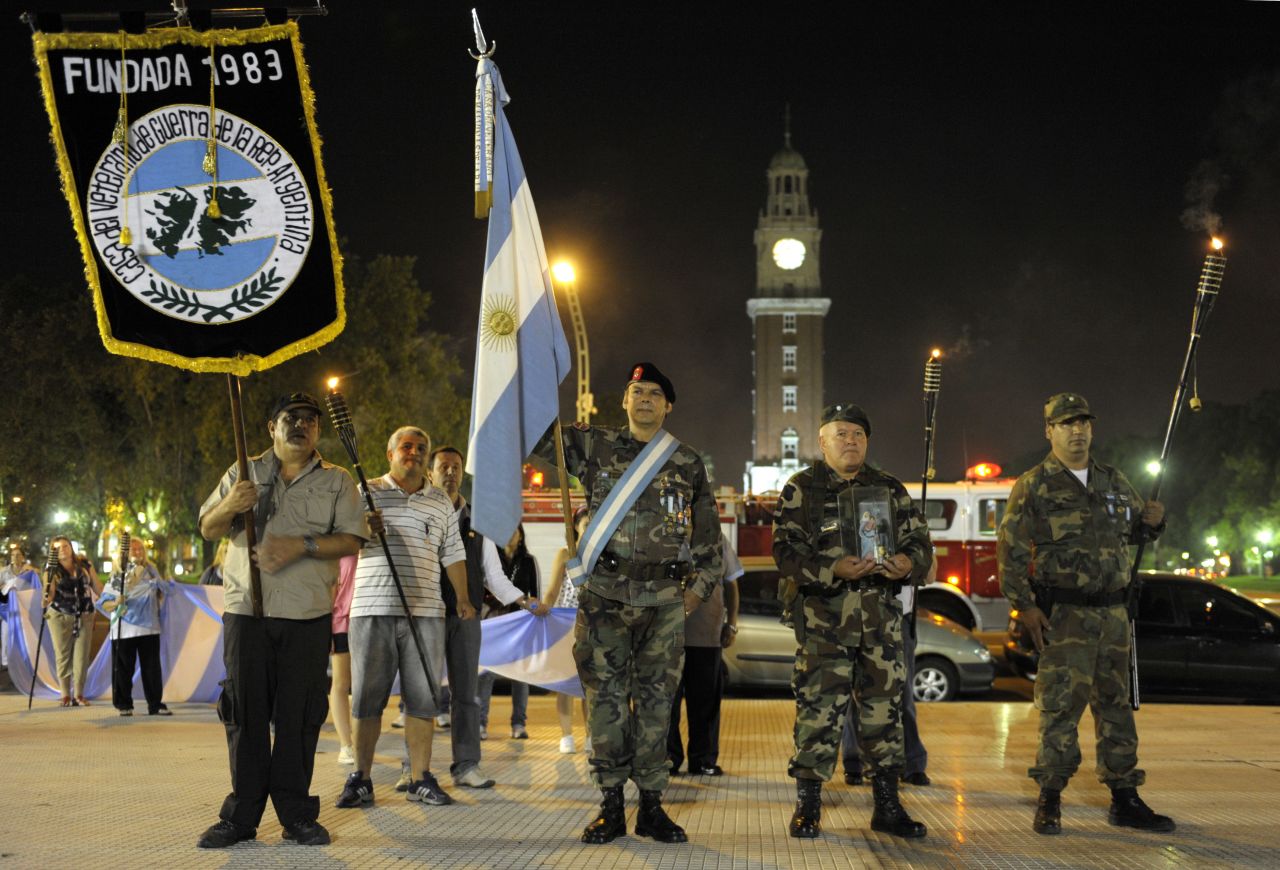 Argentinian war veterans and relatives march with torches in Buenos Aires during the 28th anniversary of the 1982 conflict.