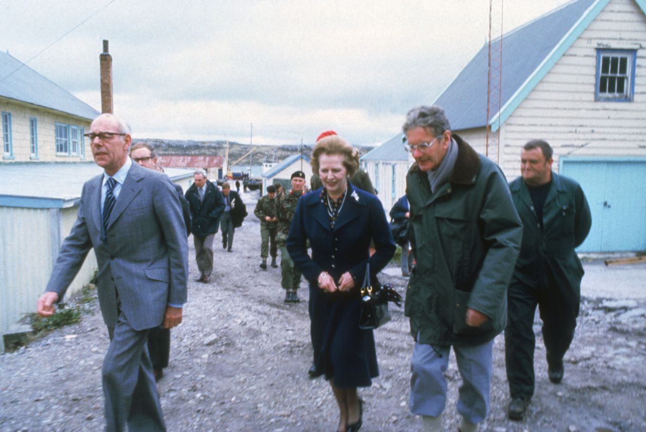 British Prime Minister Margaret Thatcher and her husband Denis, left,  visit Stanley Junior School, Stanley on the Falkland Islands in 1983. 