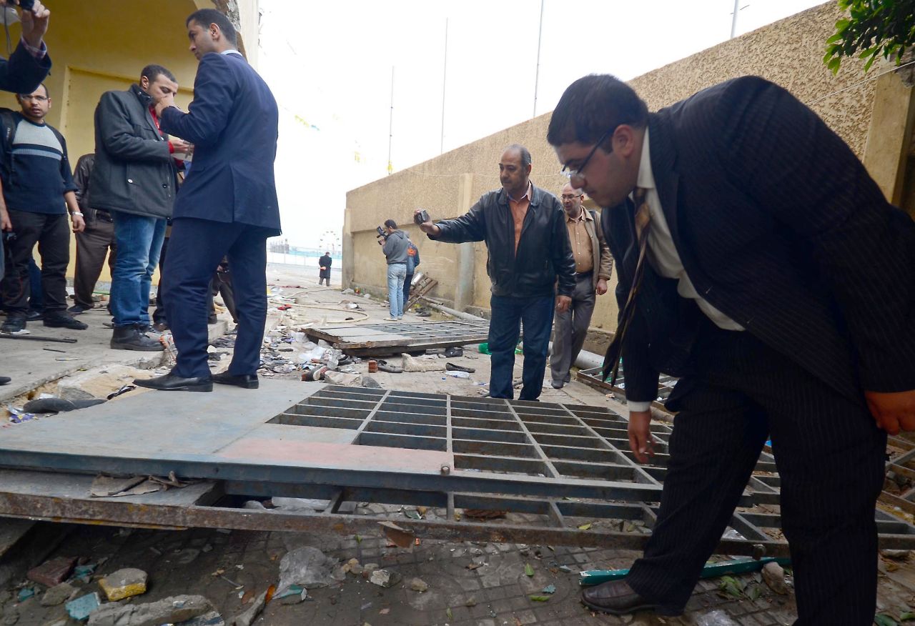 Egyptian investigators inspect damage at the football stadium in Port Said on Thursday.