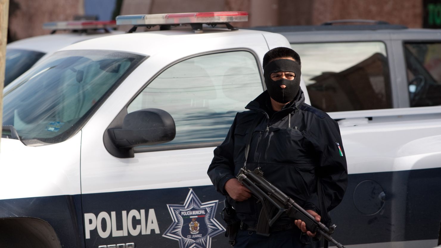 A police officer guards one of the hotels where policemen are billeted on January 31 in Ciudad Juarez, Mexico. 
