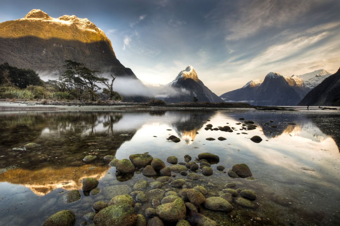 Dawn breaks over Mitre Peak in Milford Sound, the most famous of the 15 fjords in Fiordland National Park.
