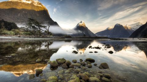 Dawn breaks over Mitre Peak in Milford Sound, the most famous of the 15 fjords in Fiordland National Park.