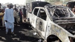 	A resident inspects a police patrol van outside Sheka police station in northern Nigerian city of Kano on January 25, 2012. The van was burnt in bomb and shooting attacks on the police station the previous night by around 30 members of Boko haram Islamists group, wounding a policeman and killing a female visitor, according to residents. AFP PHOTO / AMINU ABUBAKAR (Photo credit should read AMINU ABUBAKAR/AFP/Getty Images)