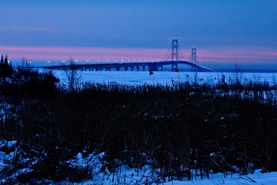 Mackinaw City, Michigan, was picked as its top tourist town. CNN iReporter John McGraw captured this winter sunrise at the Mackinac Bridge. Mackinaw City is at the bridge's south end.
