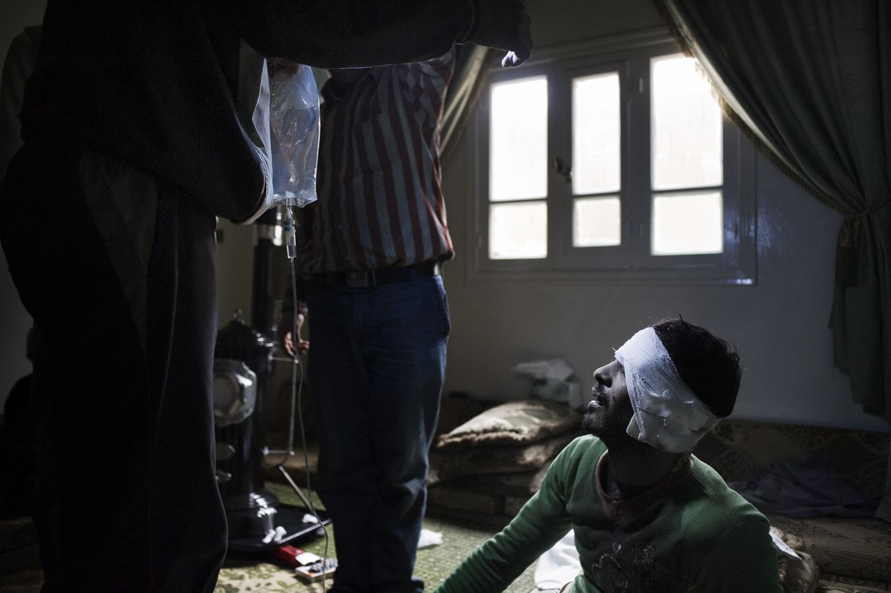 A member of the Free Syrian Army receives first aid after he was wounded by a rocket-propelled grenade on January 25. More than 5,000 people have died in Syria since the start of the government crackdown in March, according to the United Nations.