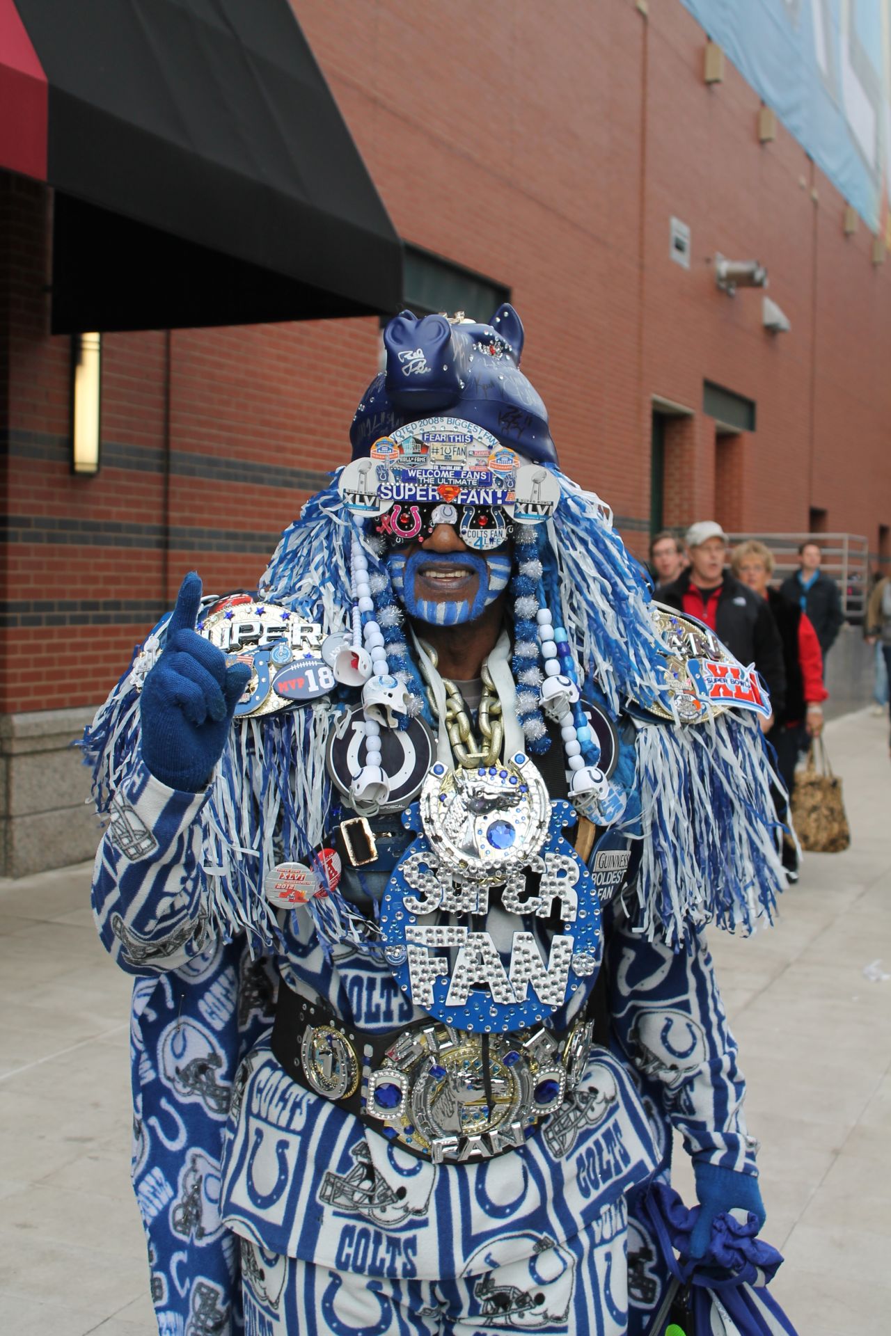 An avid fan displays the memorabilia from past and present Super Bowl contests ahead of the game in Indianapolis.