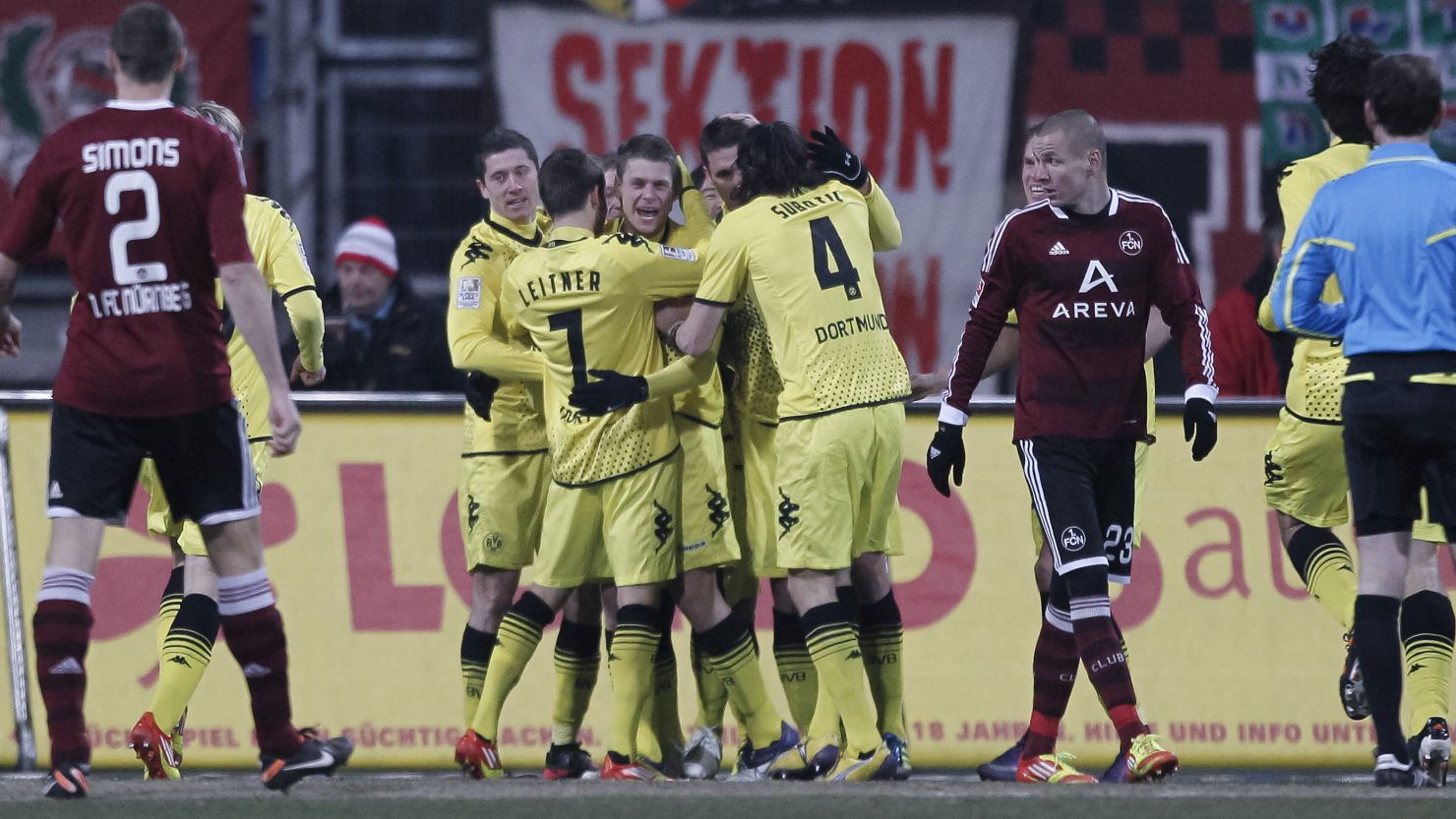 Dortmund players celebrate Sebastian Kehl's opener in the 2-0 win at Nuremberg.