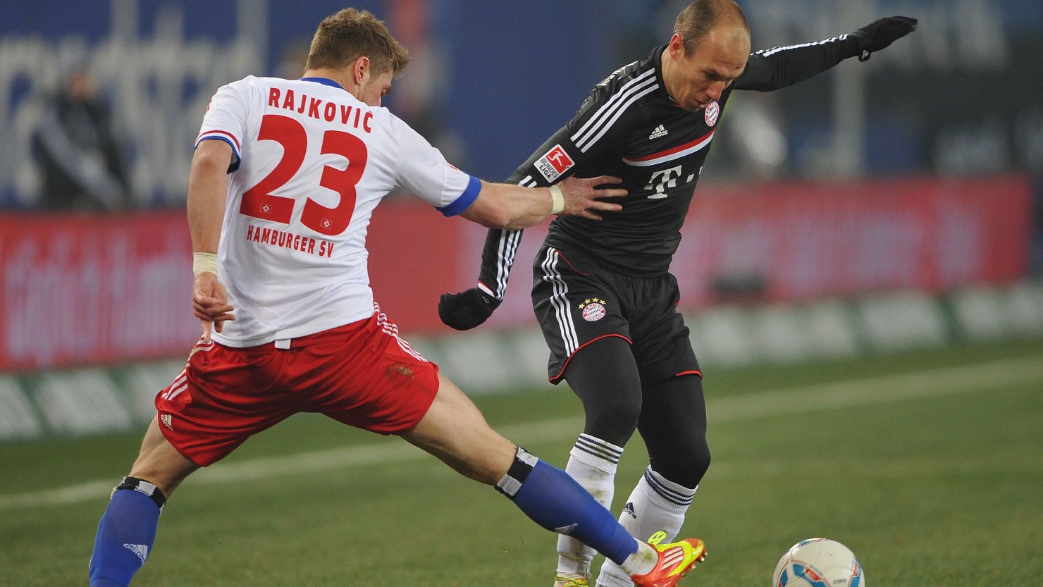 Slobodan Rajkovic of Hamburg challenges Bayern Munich's Arjen Robben during the 1-1 draw on Saturday night