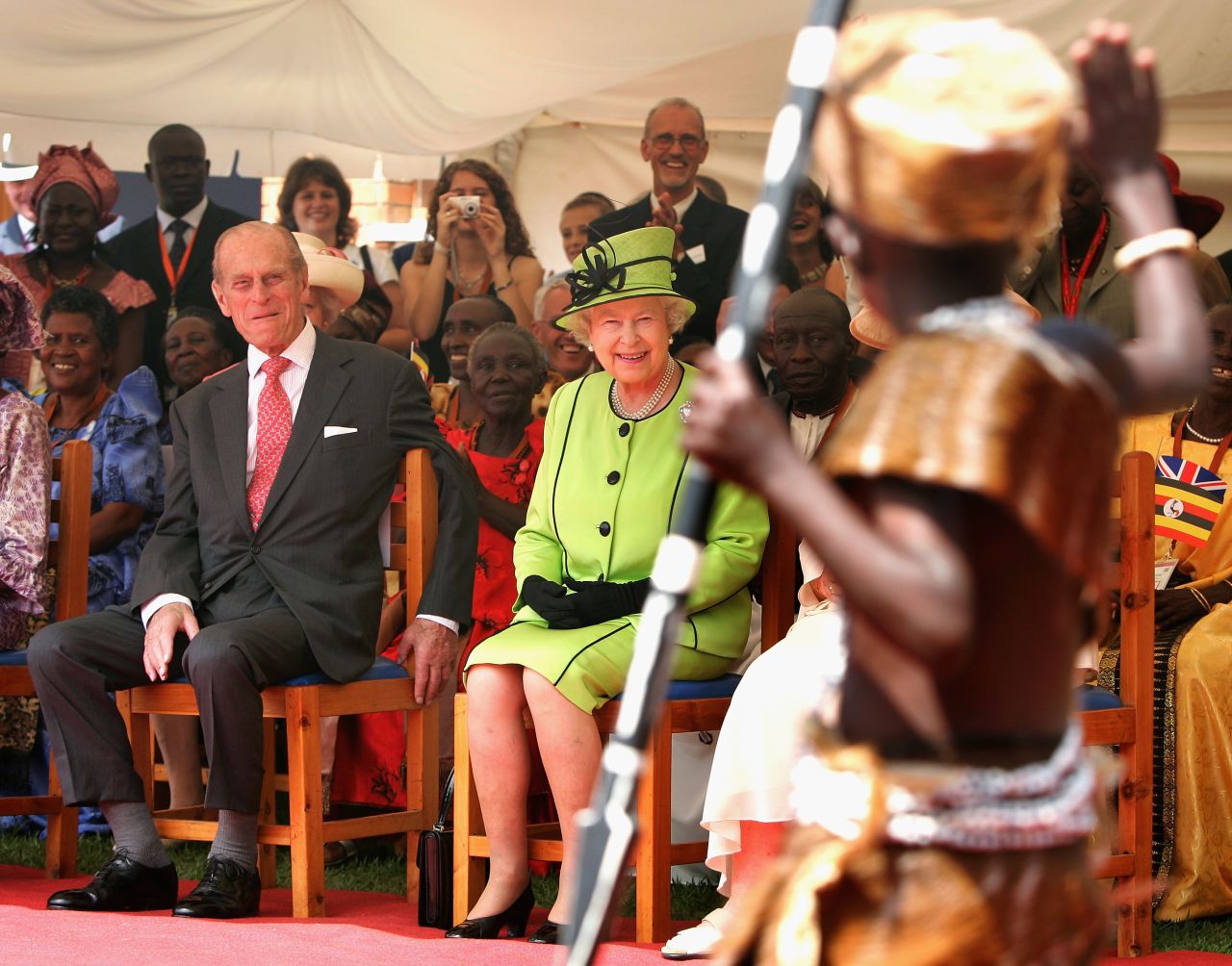 Prince Philip Queen Elizabeth II watch AIDS orphans perform a fashion show at the Mildmay centre for AIDS Orphans on November 22, 2007 in Kampala, Uganda.  
