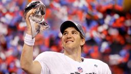 Quarterback Eli Manning poses with the Vince Lombardi Trophy after the Giants defeated the Patriots in Super Bowl XLVI.