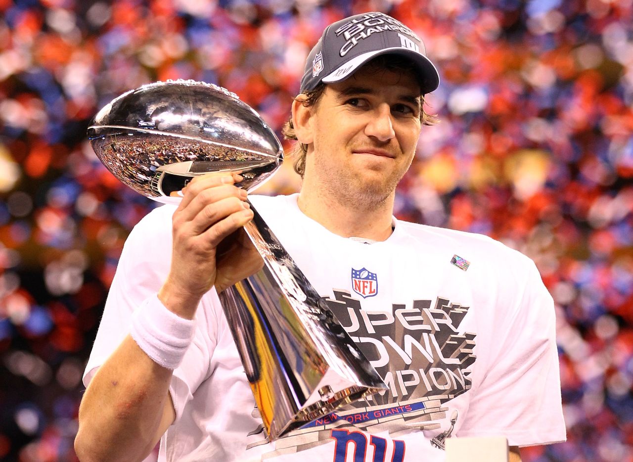 Giants quarterback Eli Manning with the Vince Lombardi trophy after their 21-17 win over the Patriots. 