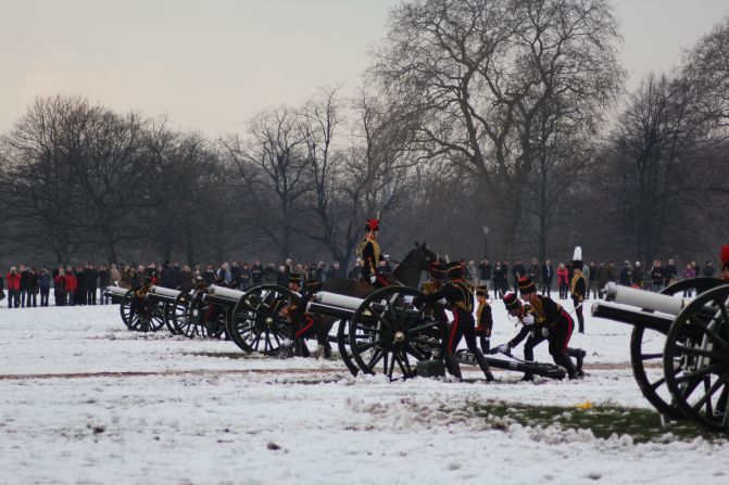 Despite the blistering cold, spectators gather to watch the salute in the picturesque west London park, home to Kensington Palace -- Princess Diana's former official residence.