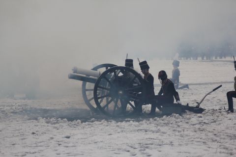 Through thick cannon mist, the gunners prepare to reload as the salute continues.