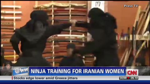 A Reuters video showed women clad head to toe in black, running up walls, flipping backwards, diving and rolling over swords.