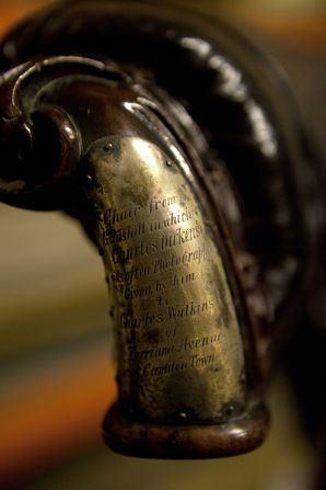 Charles Dickens's chair, at which he wrote "A Tale of Two Cities." Dickens was photographed at this chair several times around 1859. The chair carries a silver plate engraved with its history.