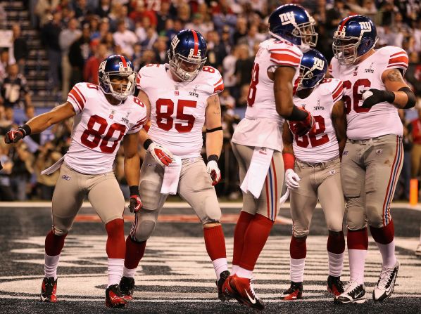 Victor Cruz (no 80) is congratulated after scoring the first touchdown of the Super Bowl for the New York Giants