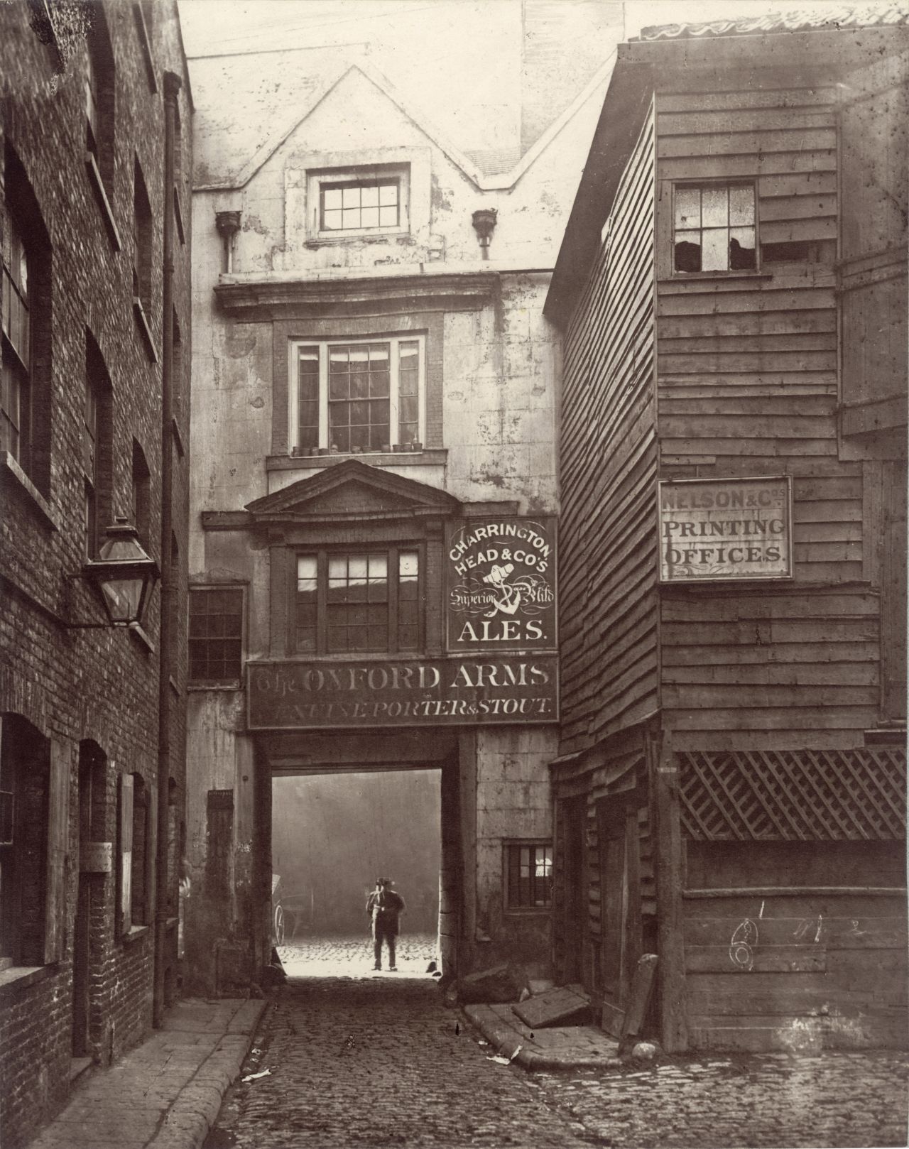 The Oxford Arms inn, demolished in 1876, was typical of the "ancient hostelries" that had "degenerated into little more than the abiding and booking-places of country wagons," according to Dickens.