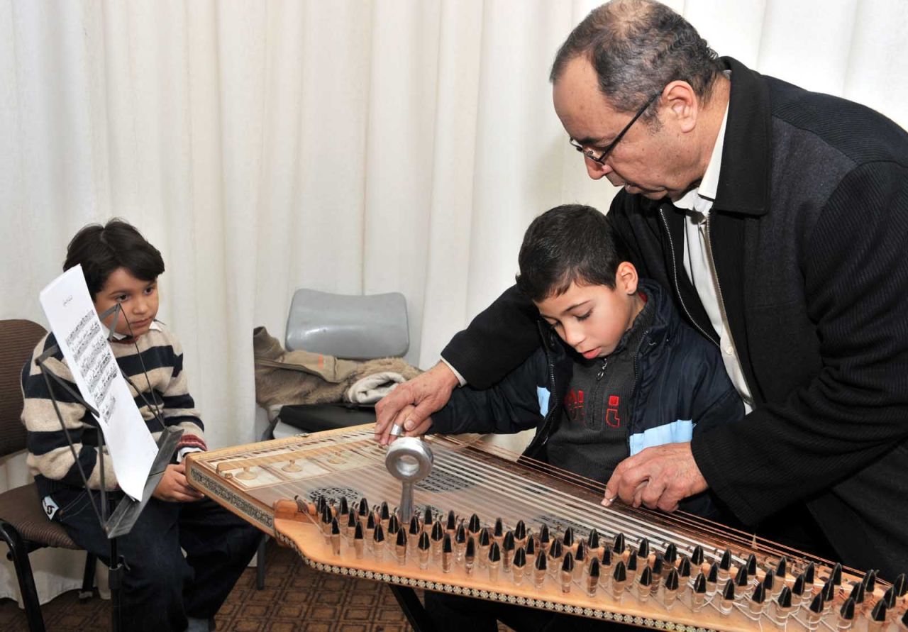 Gaza Music School Academic Co-ordinator Ibrahim Najjar teaches the Arabic instrument kanun