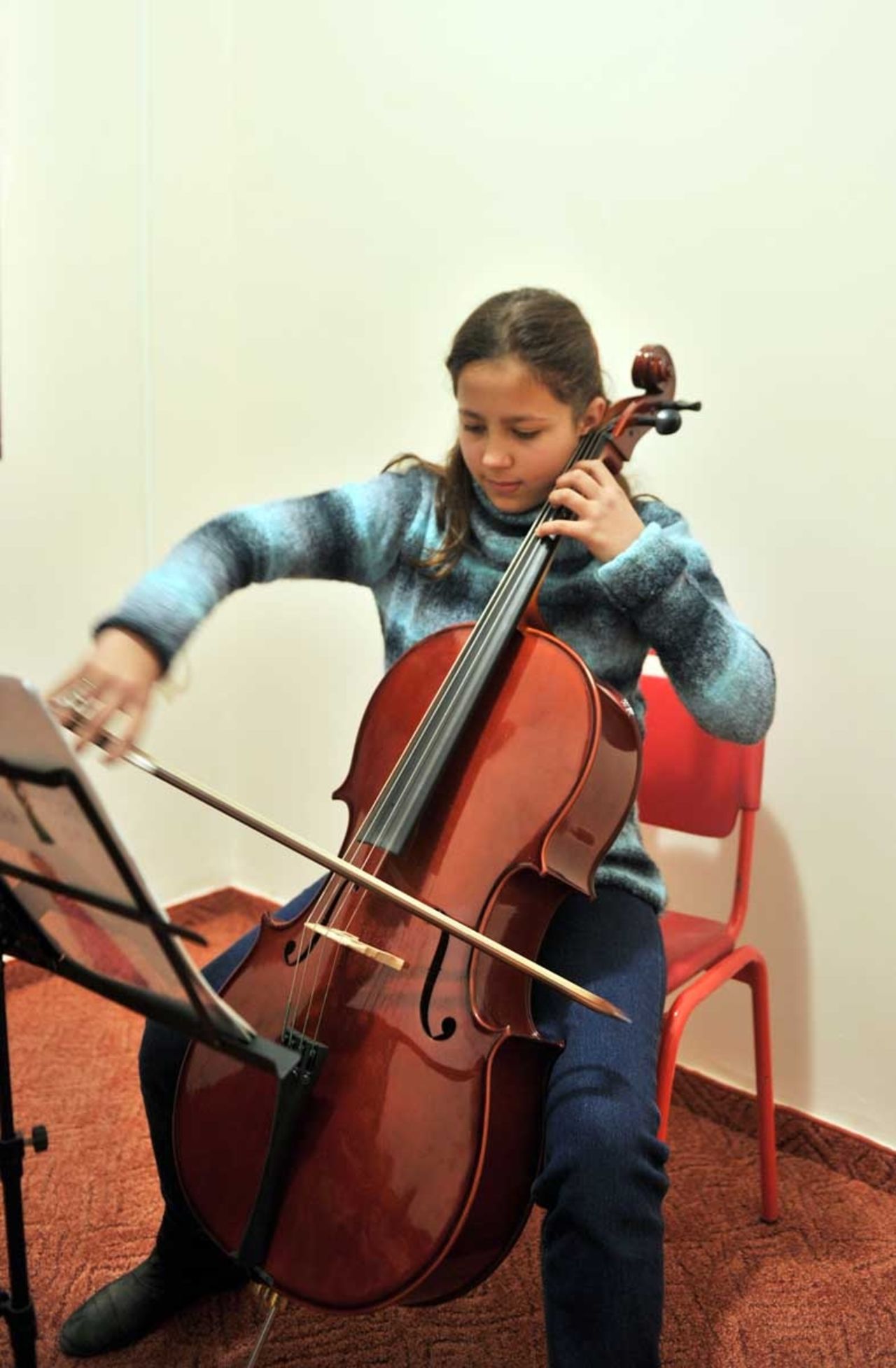 A cello student  practising. Cello is one of the Western Classical instrument taught at Gaza Music School. 