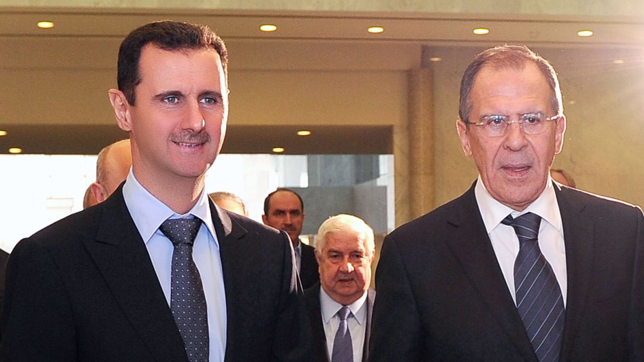 Bashar al-Assad (L) and Russian FM Sergei Lavrov in Damascus for talks on February 7.